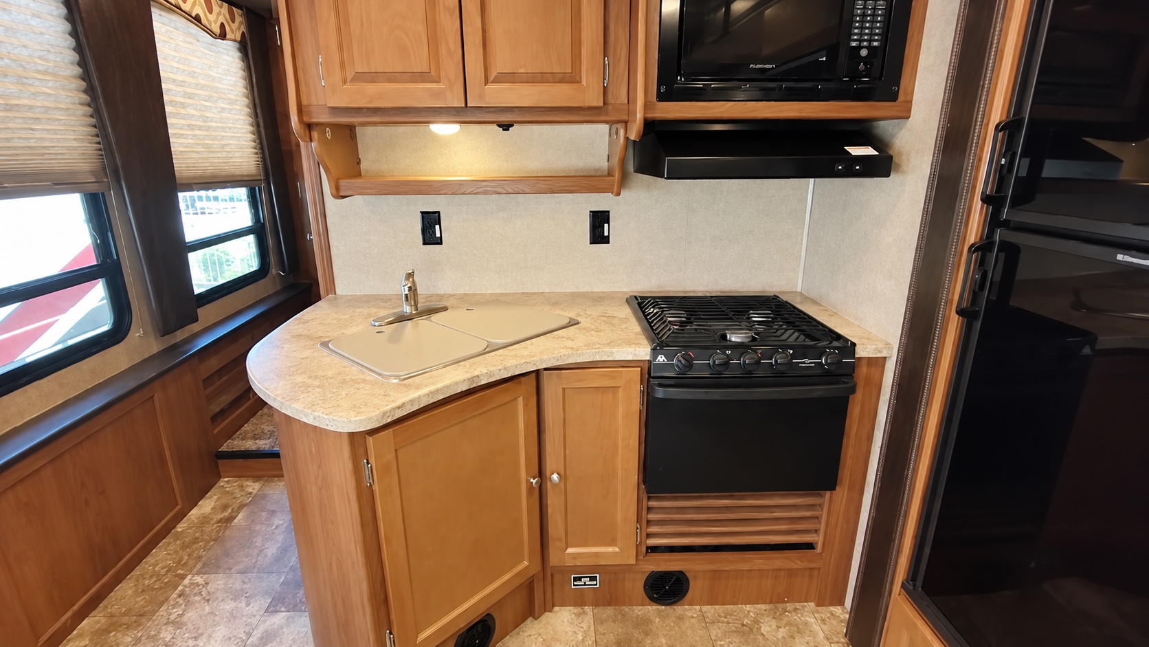 Kitchen range, microwave, and sink